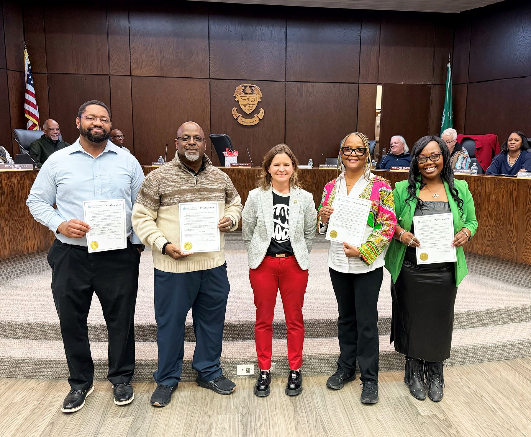 Mayor Michelle Nelson stands with Flossmoor educator at Village Hall